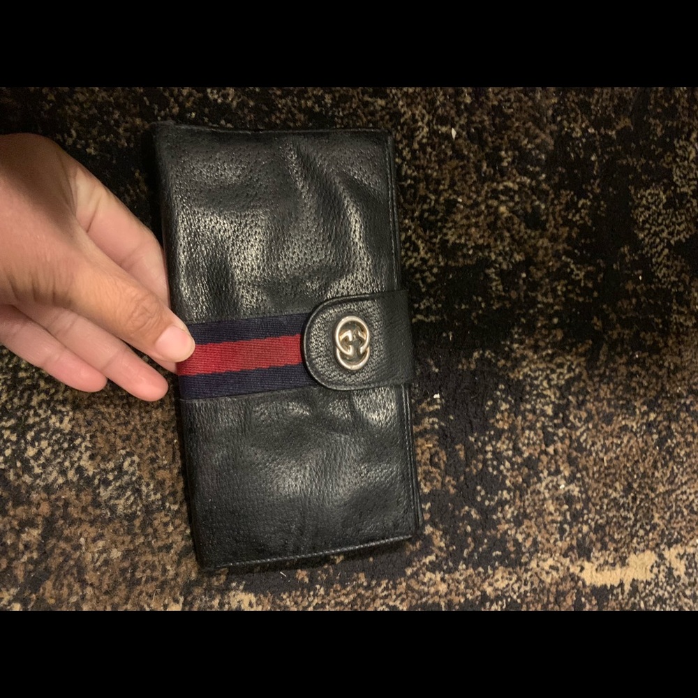 Gucci check book holder.